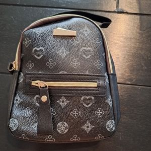 Small Black backpack with gray designs